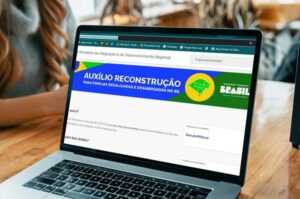 Imagem ilustrativa sobre o golpe do Auxílio Reconstrução, mostrando a página oficial do governo