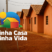 "Imagem do programa Minha Casa, Minha Vida com casas em construção e logotipo do programa sobreposto."