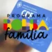 Cartão do CPF com logo do Programa Bolsa Família sobreposto.