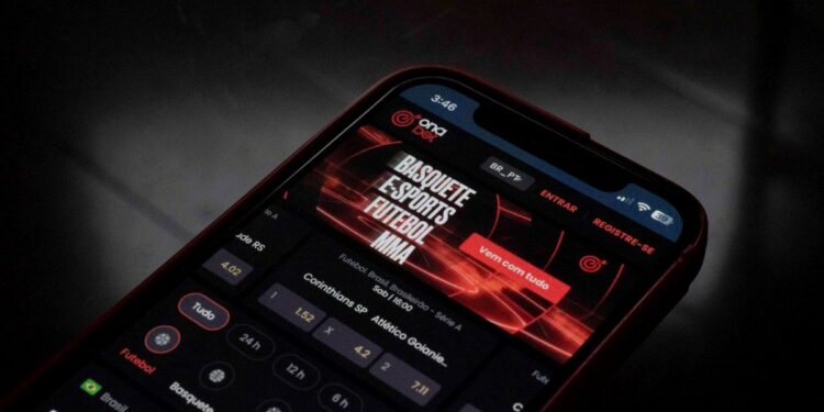 Um smartphone exibindo a tela de um aplicativo de apostas online, com a marca 'Ona Bet' em destaque.