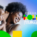 Mulher negra sorrindo segurando bebê, com logotipo do Programa Bolsa Família ao lado.