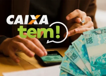 Mãos sobre celular com logo da Caixa e a frase "Caixa Tem!", ao lado de notas de 100 reais, ilustrando o Pix premiado.